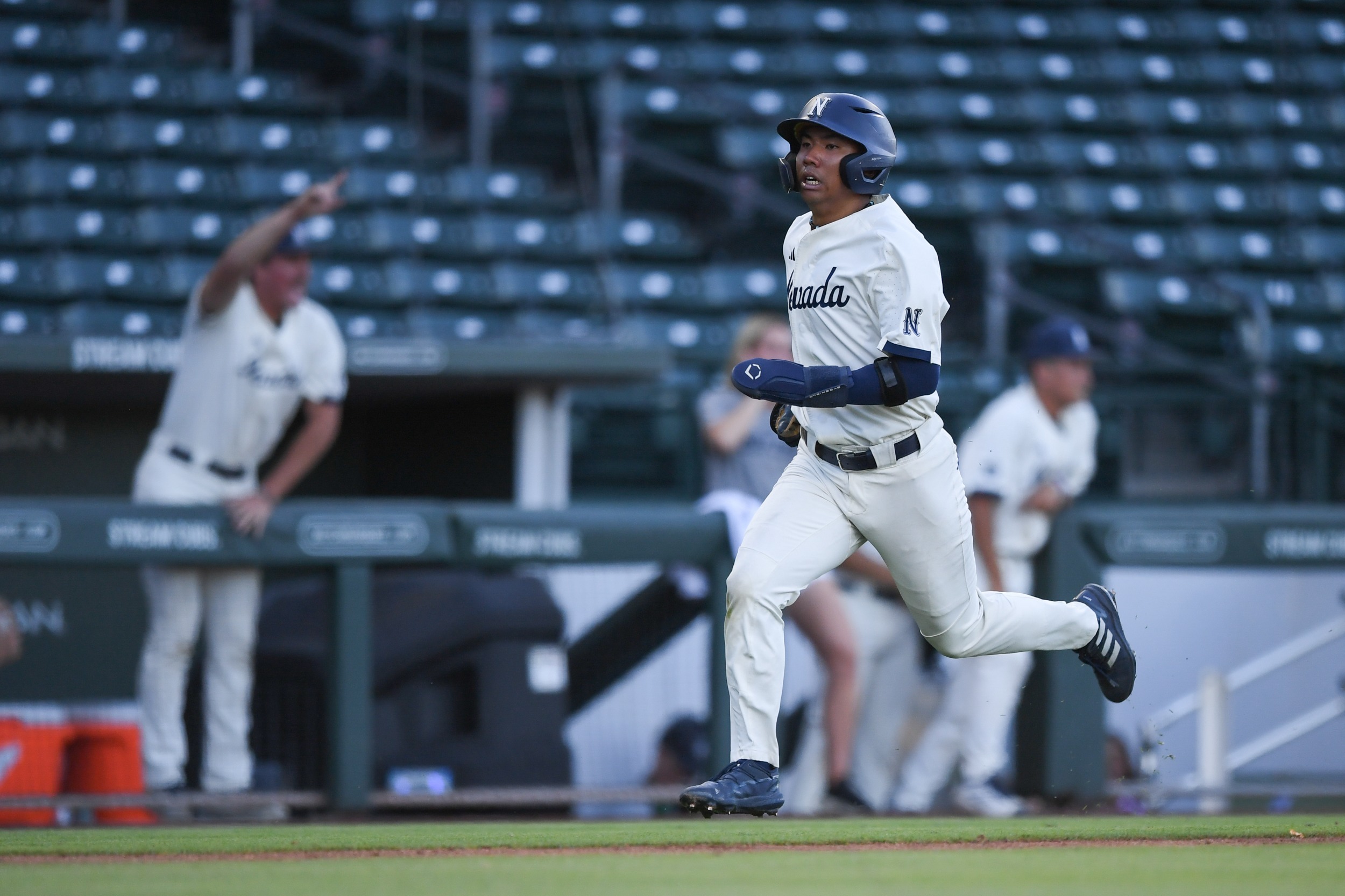 A Nevada baserunner in action during conference play; Mountain West programs prepare for the 2026 Credit Union 1 Championship bracket in Mesa, Ariz.
