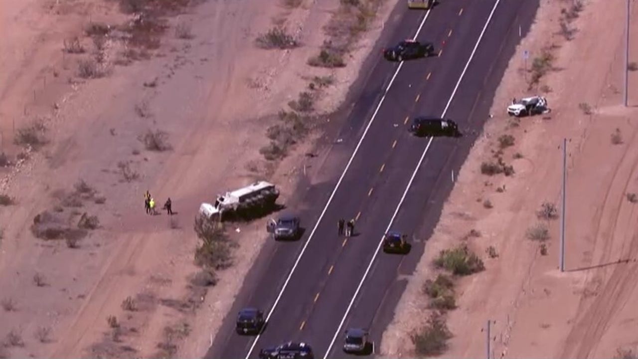 Aerial view of State Route 74 near Lake Pleasant showing multiple vehicles and emergency presence as crews investigate and lanes remain restricted following the fatal three-vehicle collision.