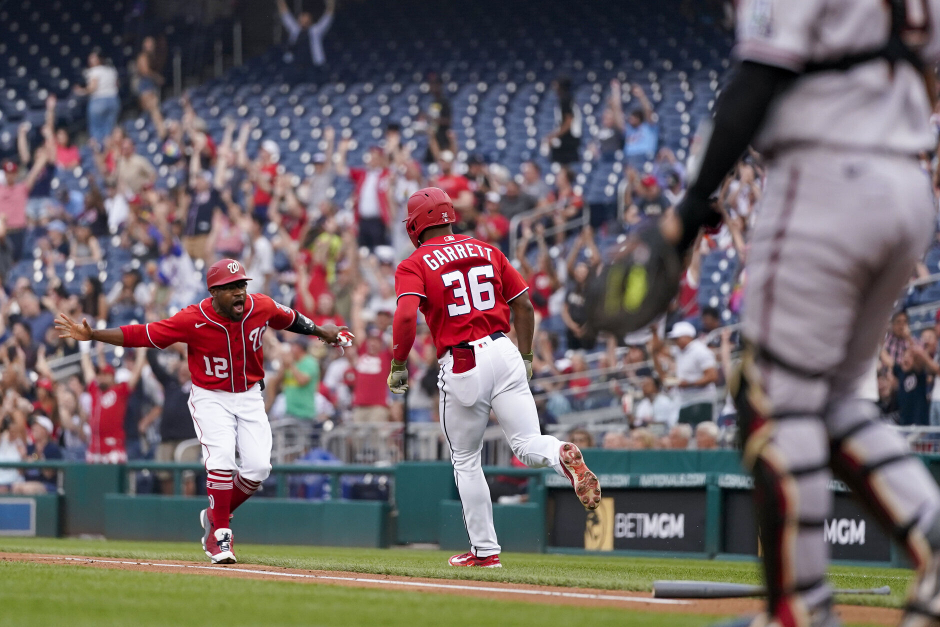 Washington Nationals players celebrate a home run during the five-homer outburst that powered a 14-1 win over the Diamondbacks.