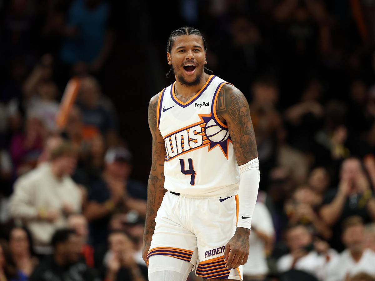 Phoenix Suns guard No. 4 reacts on the court in a game action shot used to illustrate debate over whether the club should move the young guard.