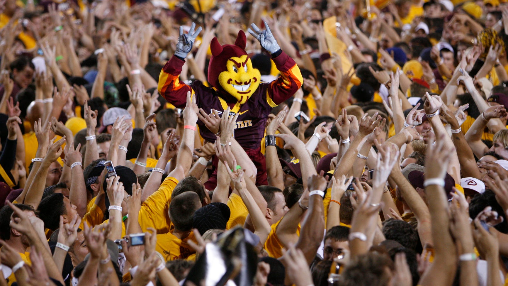 Sparky is hoisted by a sea of Sun Devils fans in the stands — the team’s upcoming London game and its broadcast details were confirmed in the announcement.