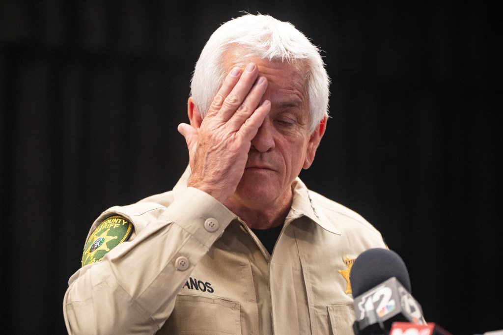 Pima County sheriff reacts at a Feb. 5, 2026 press conference about the Nancy Guthrie search, a moment that has come under scrutiny amid perjury allegations and calls for his removal.