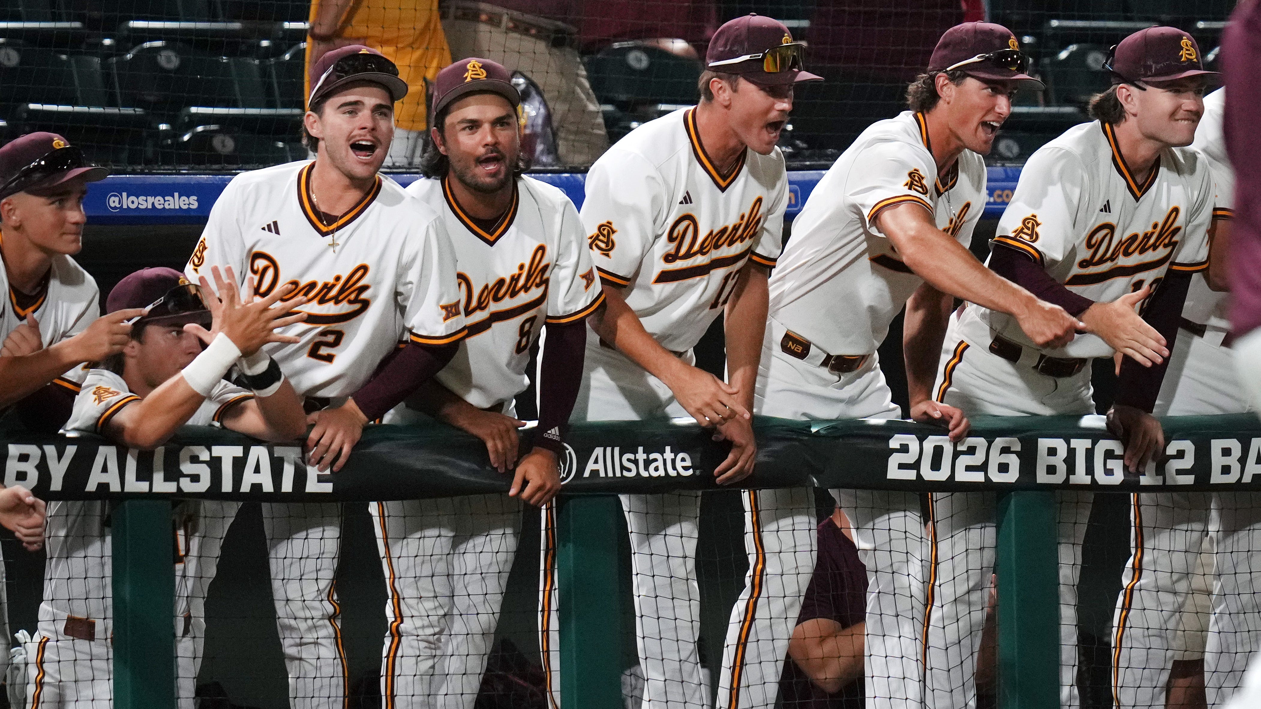 Arizona State teammates erupt in the dugout celebrating a key moment in the Sun Devils’ victory over Nebraska as they prepare to face Ole Miss for a CWS berth.