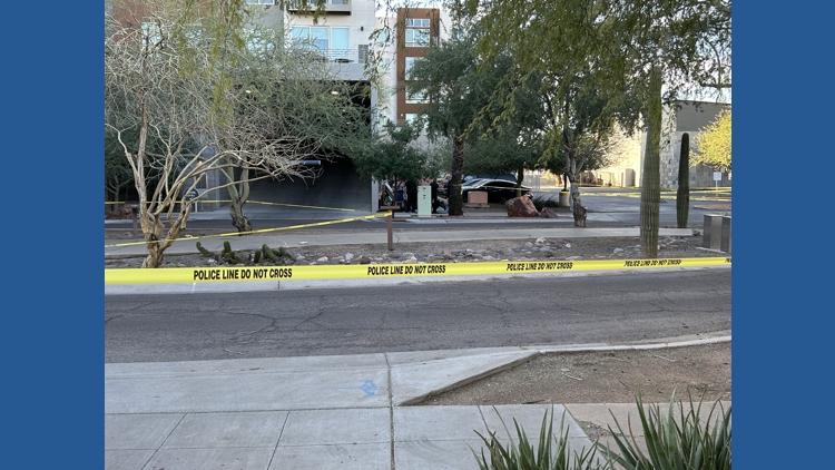 A cordoned-off area with police tape outside a building near 9th Street and Indian School Road in central Phoenix as detectives investigate the scene.