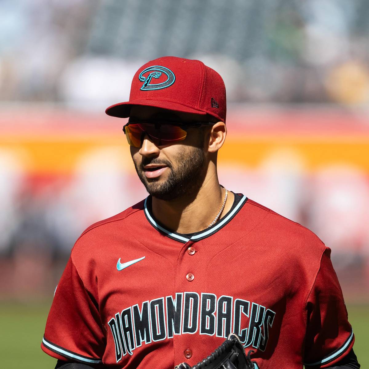 Diamondbacks position player in uniform and sunglasses during pregame — manager Torey Lovullo says position players are progressing in their recoveries and could return soon.
