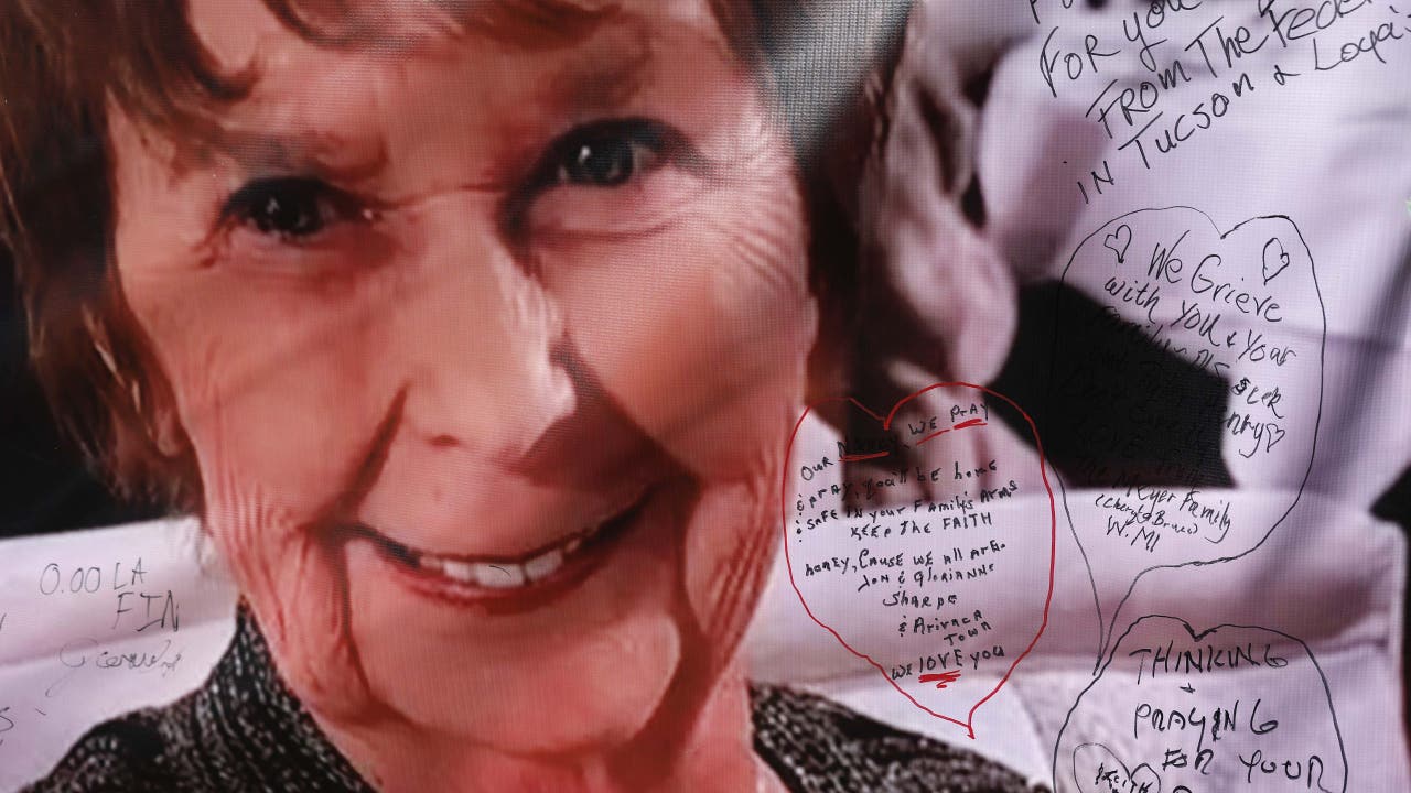 Close-up portrait of the victim overlaid with handwritten condolence messages left by community members amid the ongoing investigation into whether she was targeted.