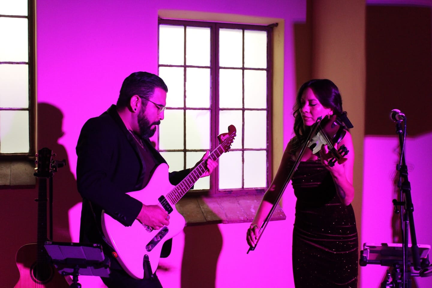 Live musicians perform under colorful lighting inside the museum as part of the grown‑ups’ Nostalgia Night celebration marking the museum’s 40th year.